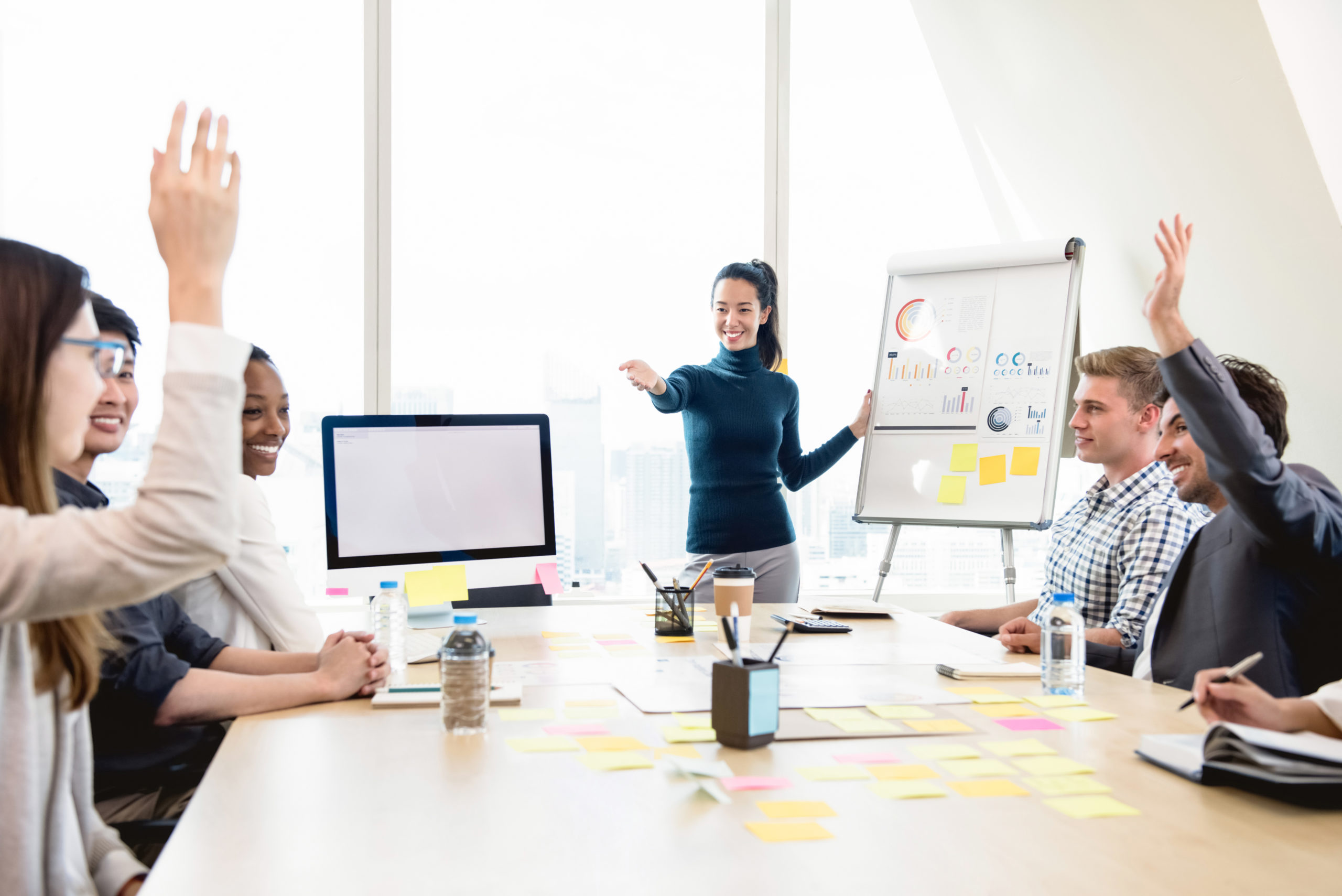 Young casual Asian businesswoman leader asking for opinion in the meeting
