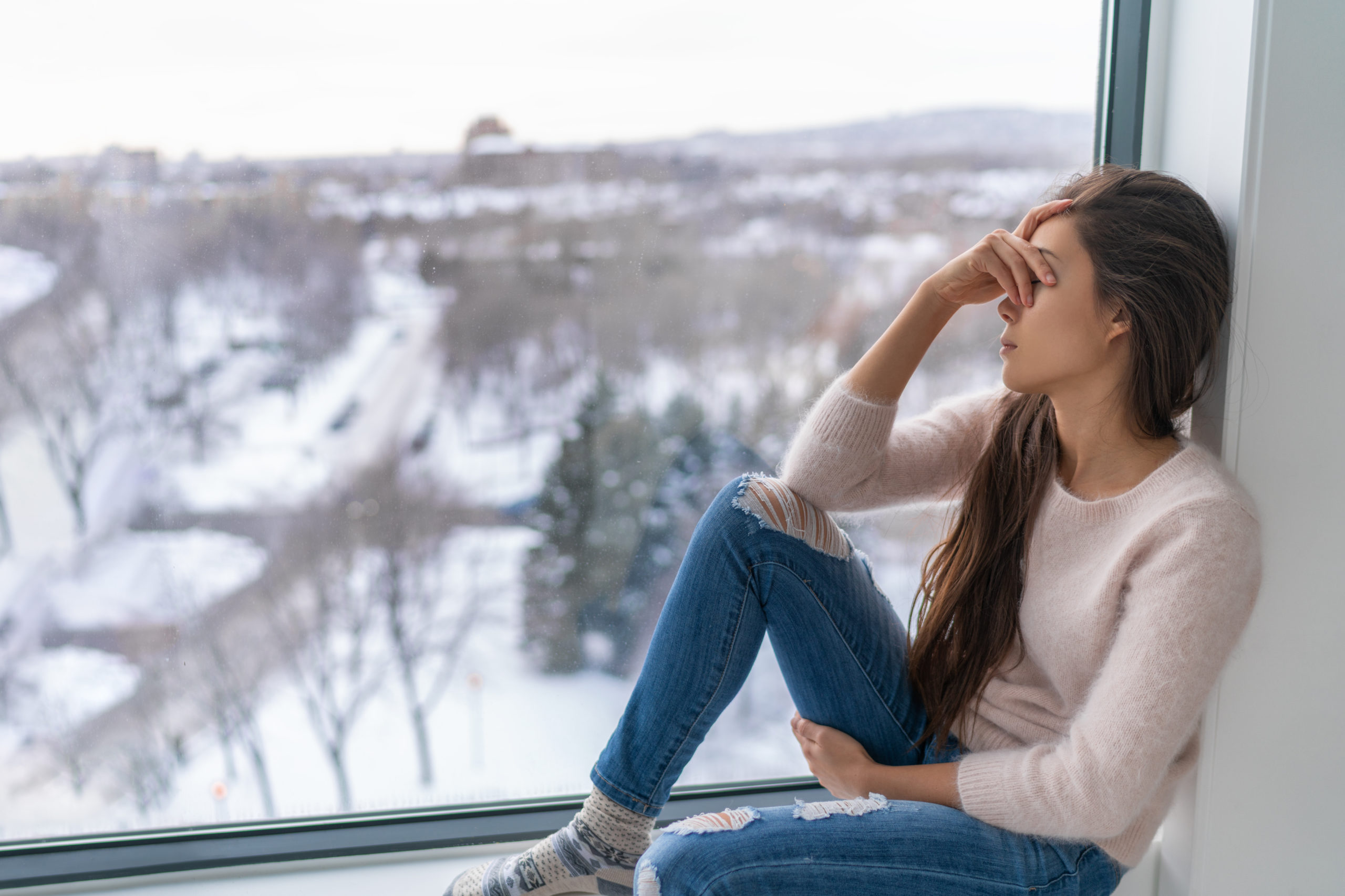 Seasonal affective disorder SAD depression winter season anxious alone young girl feeling lonely – stress, anxiety, melancholy emotion at home. Mental health problem.