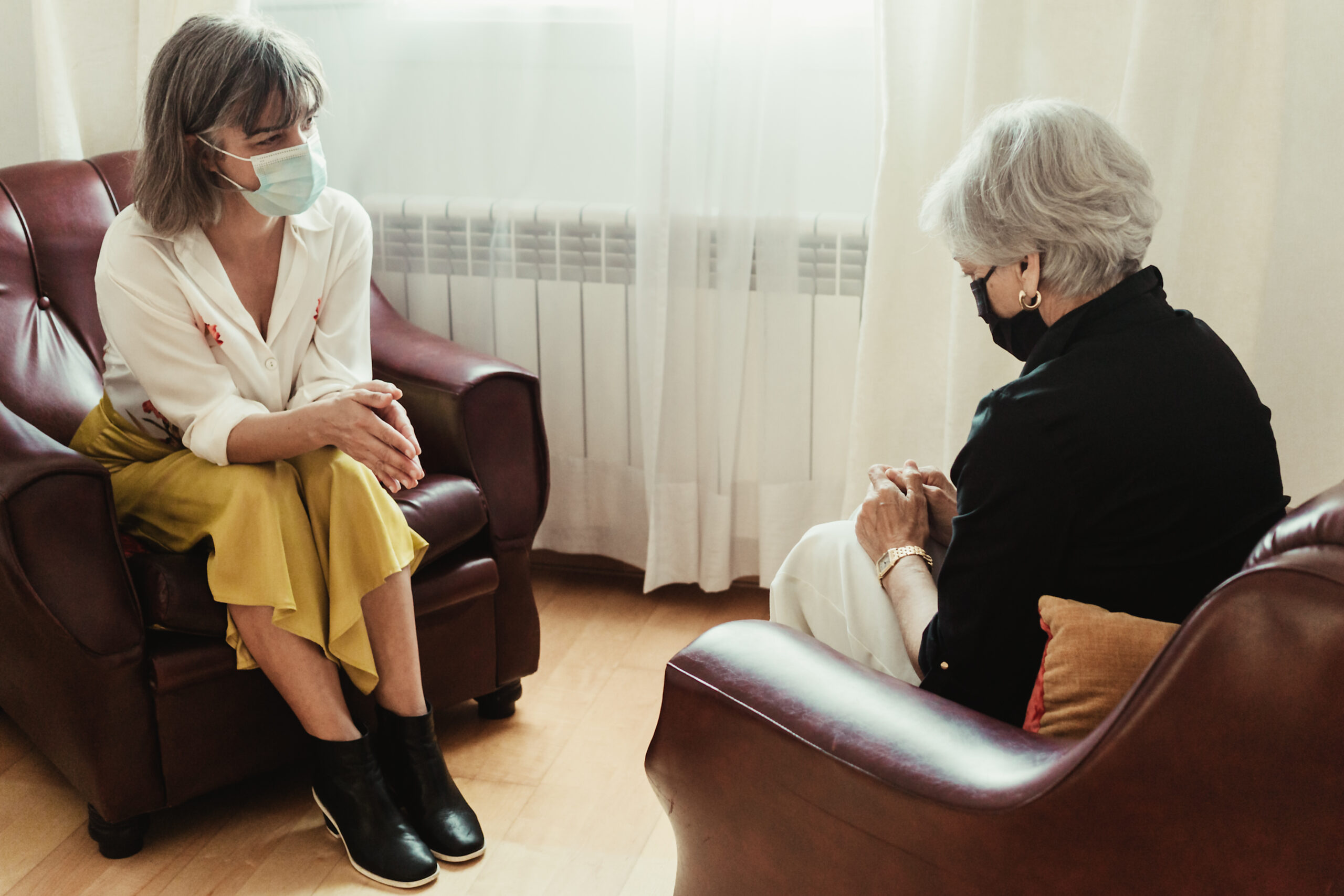 Worried senior woman patient and psychologist