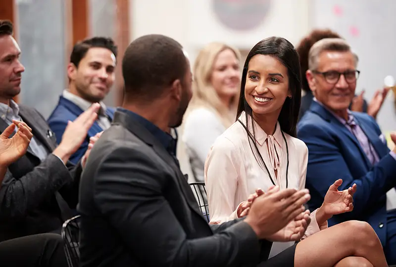 Conference attendees clapping